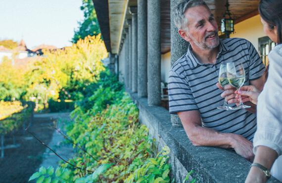 Two Back-roads travelers drinking Champagne together at a vineyard in Burgundy.