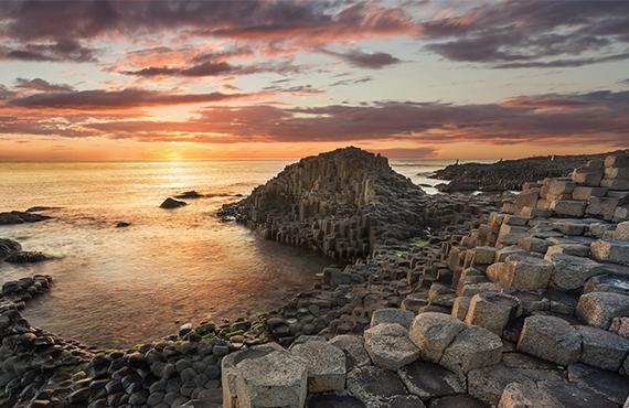A view of the Giant's Causeway in Northern Ireland during sunset.