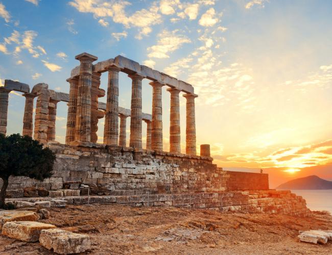 the temple of poseidon under a glowing sun