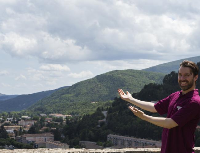 Man holding out arms in welcome