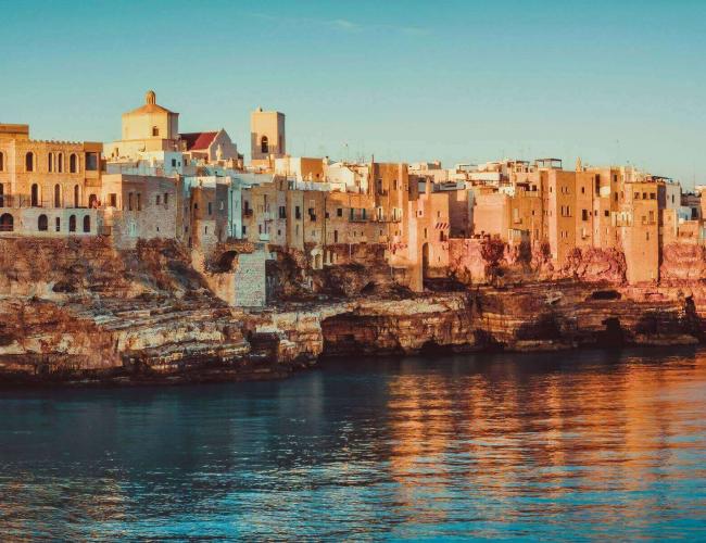 panoramic view of poliagno mare at sunrise (puglia, italy)
