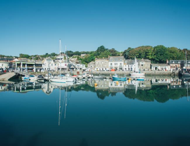 Padstow harbour, Cornwall, with fishing boats, shops and restaurants