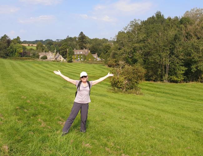 woman standing in green field 