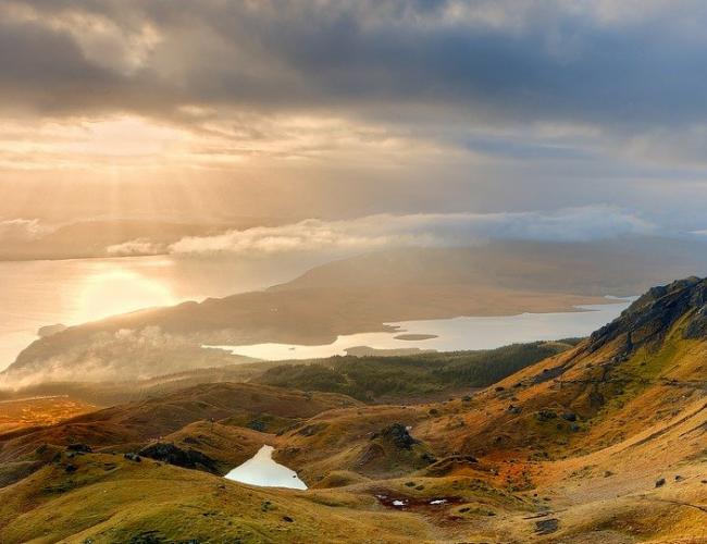 sun setting beyond the Old Man of Storr on the Isle of Skye