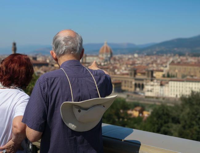 A couple overlooking an Italian cityscape