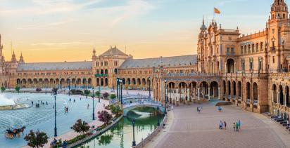 A view of the Plaza de Espana in Madrid during sunset.