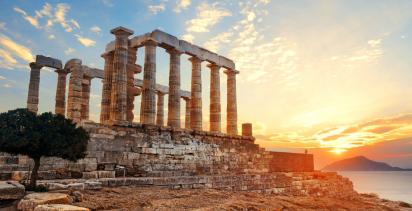 the temple of poseidon under a glowing sun