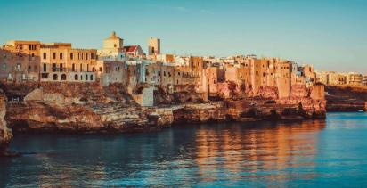 panoramic view of poliagno mare at sunrise (puglia, italy)