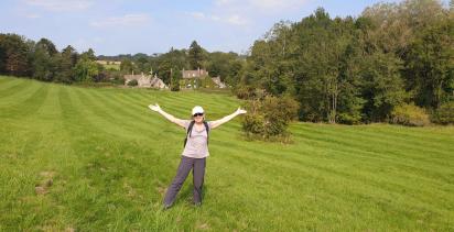 woman standing in green field