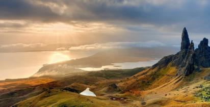 sun setting beyond the Old Man of Storr on the Isle of Skye