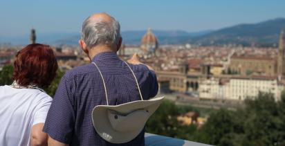 A couple overlooking an Italian cityscape