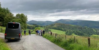 A small group of travellers embracing the beautiful scenery on a Back-Roads Highlights of Britain tour.