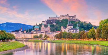 beautiful view of salzburg city skyline in the summer with pink and lilac clouds