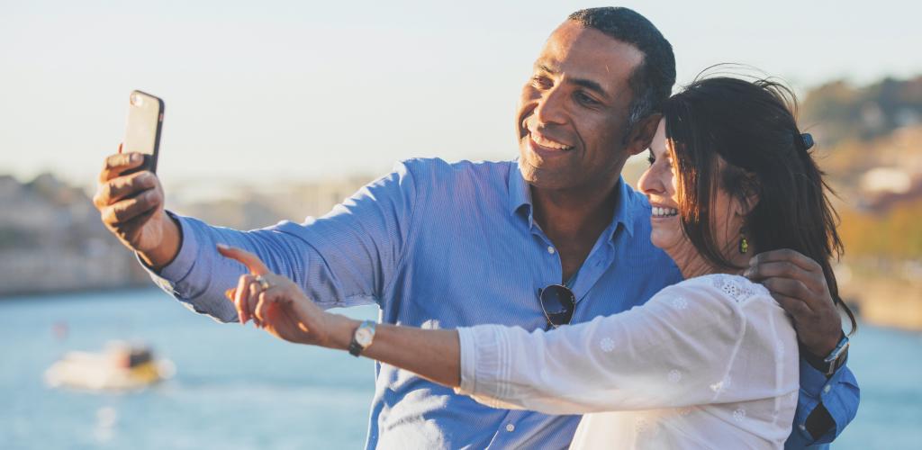 couple taking selfie beach