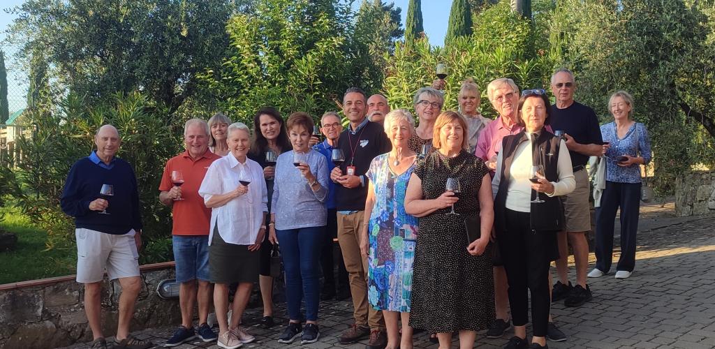 Group posing outside at a winery