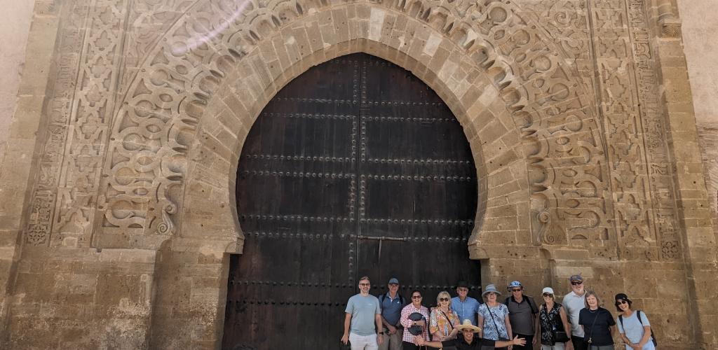 Group posing by big door in Rabat
