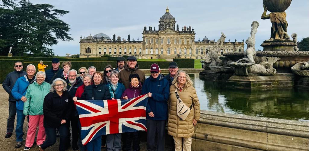 Group posing outside palace