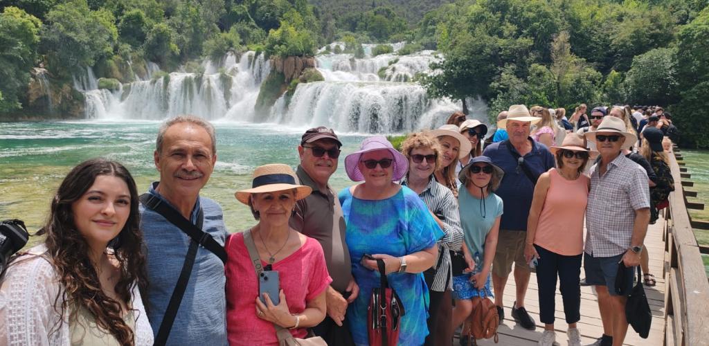 Group posing at waterfall in Krka National Park