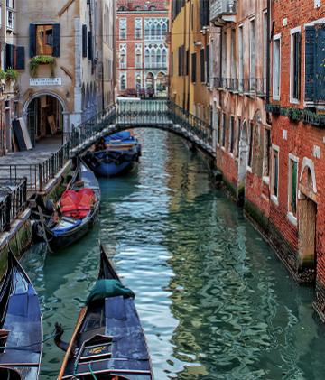 A view from a gondola ride through the historic canals of Venice.