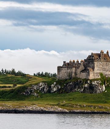 A lakeside view of Duart castle in Scotland.